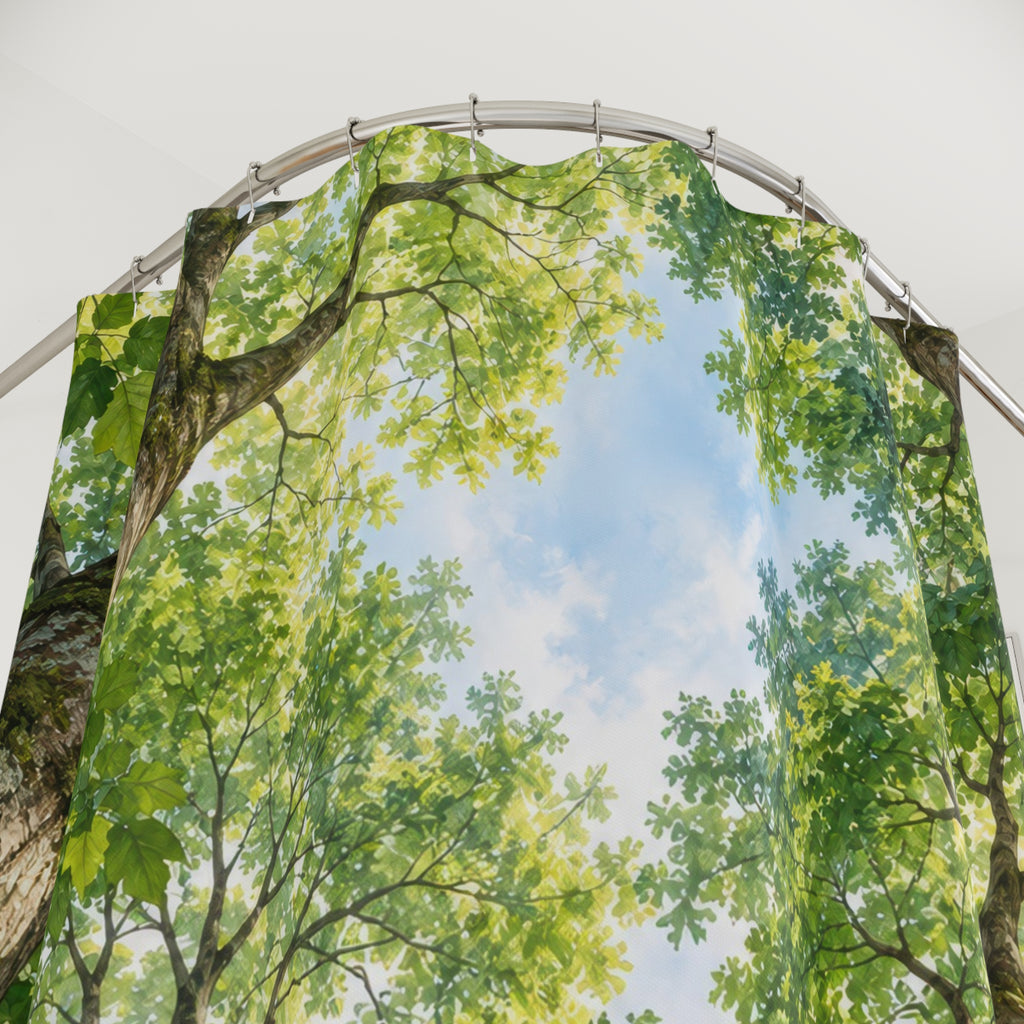 Green tree canopy around pale blue sky shower curtain with close-up print, hooks, and folds
