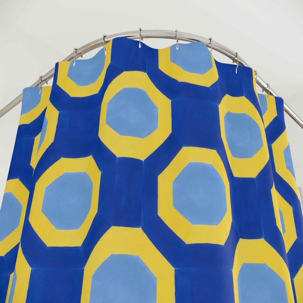 Yellow octagonal bands and pale blue centers on cobalt shower curtain with close-up print, hooks, and folds