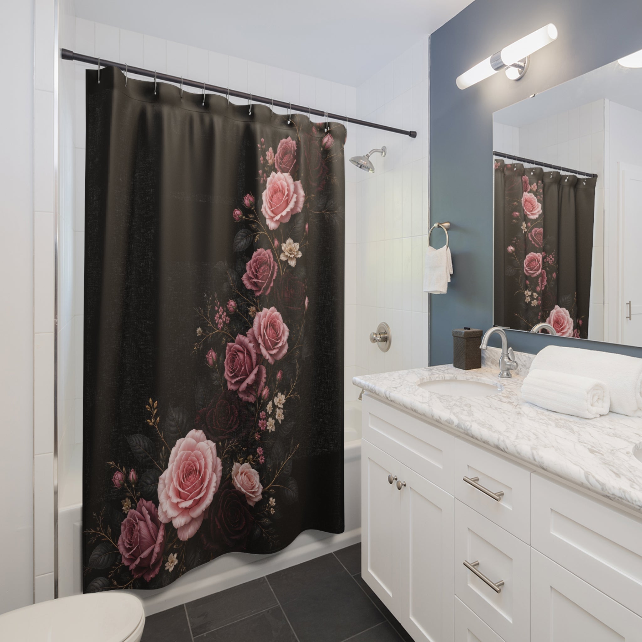 Pink and burgundy roses rising in a serpentine curve on black shower curtain installed beside a white vanity