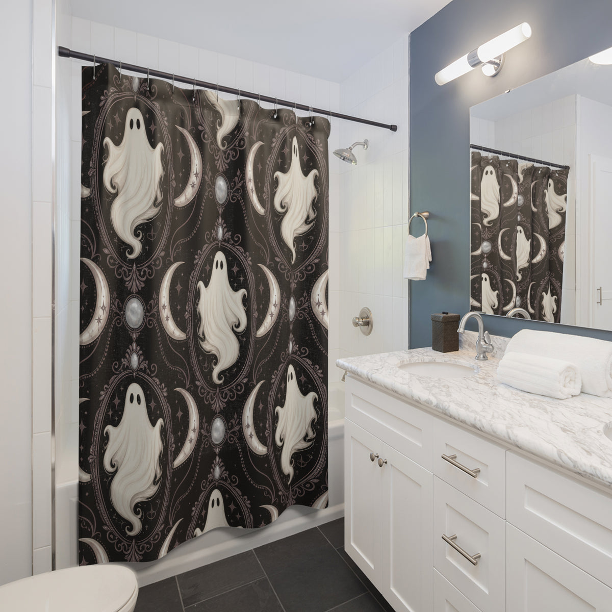 Ivory white ghost cameos with mauve crescents shower curtain beside a white vanity