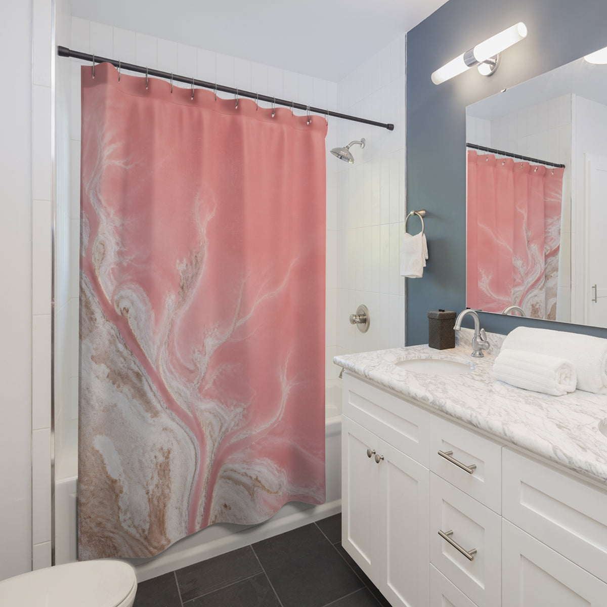 Aerial blush pink salt lagoon and branching white shore shower curtain beside a white vanity