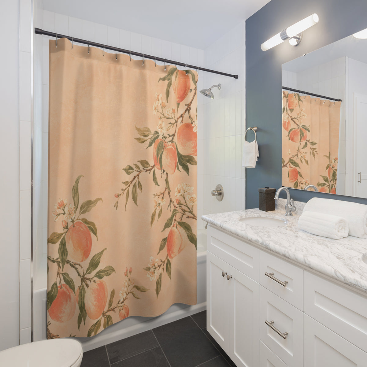 Peachy orchard fruit and cream blossoms shower curtain beside a white vanity