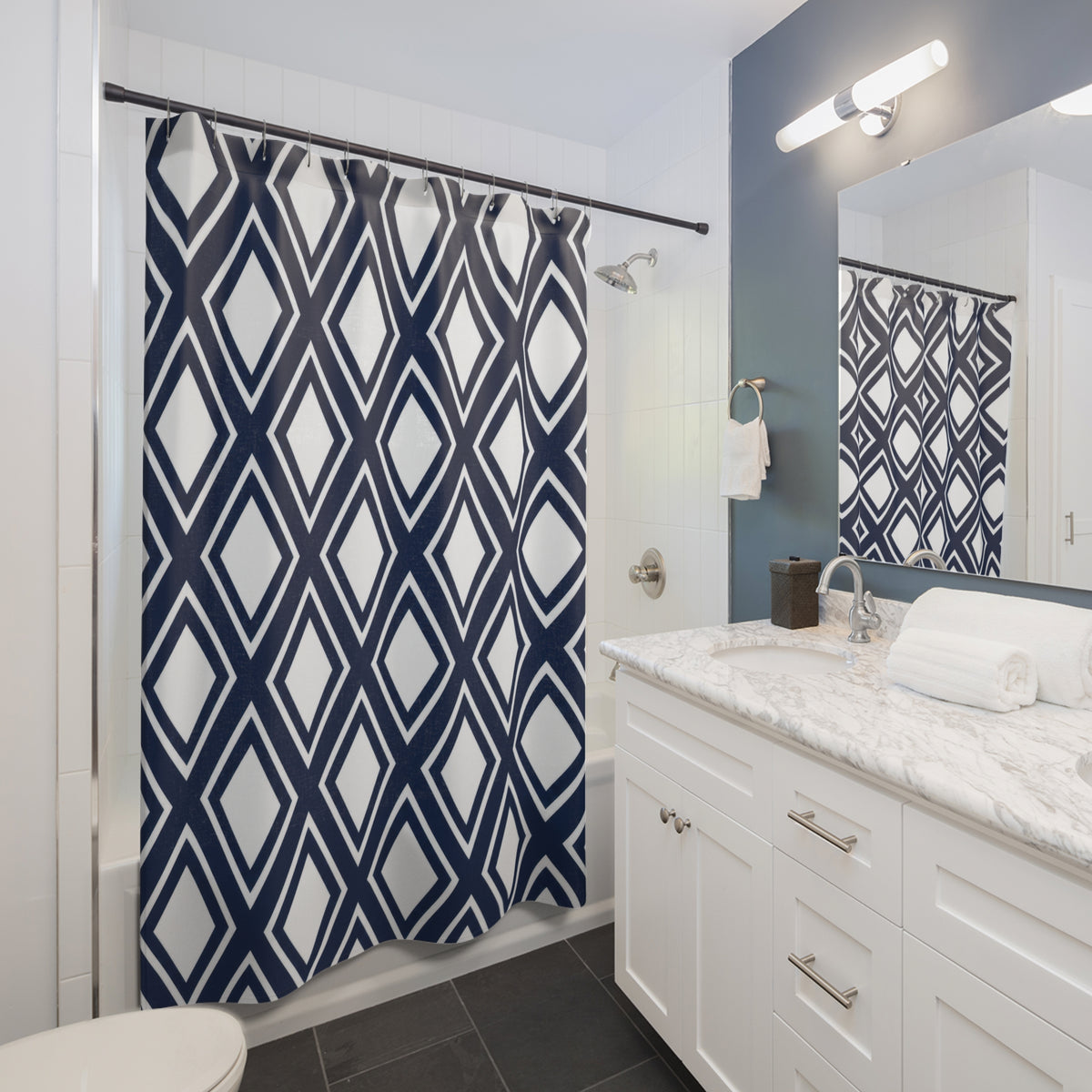 White diamonds in navy lattice with thin white outlines shower curtain beside a white vanity