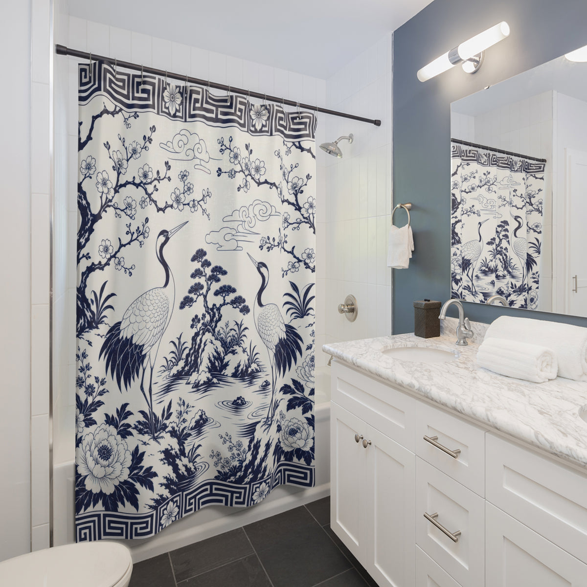 Navy Crane Garden blue white shower curtain beside a white vanity