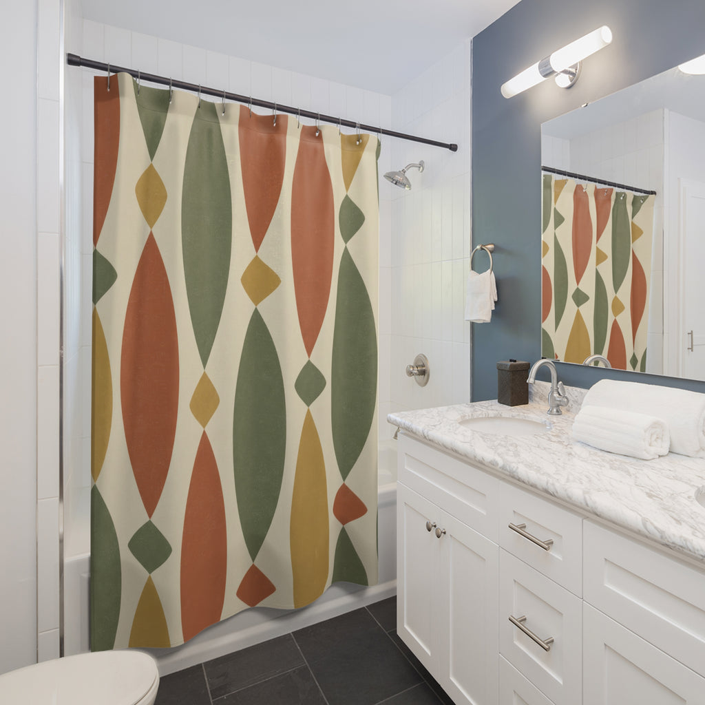 Sage and terracotta spindles with ochre diamonds on cream shower curtain beside a white vanity