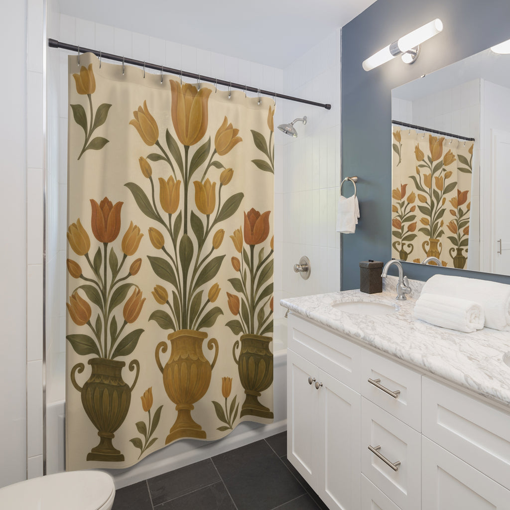 Ochre tulips and olive leaves in three urns on cream shower curtain beside a white vanity