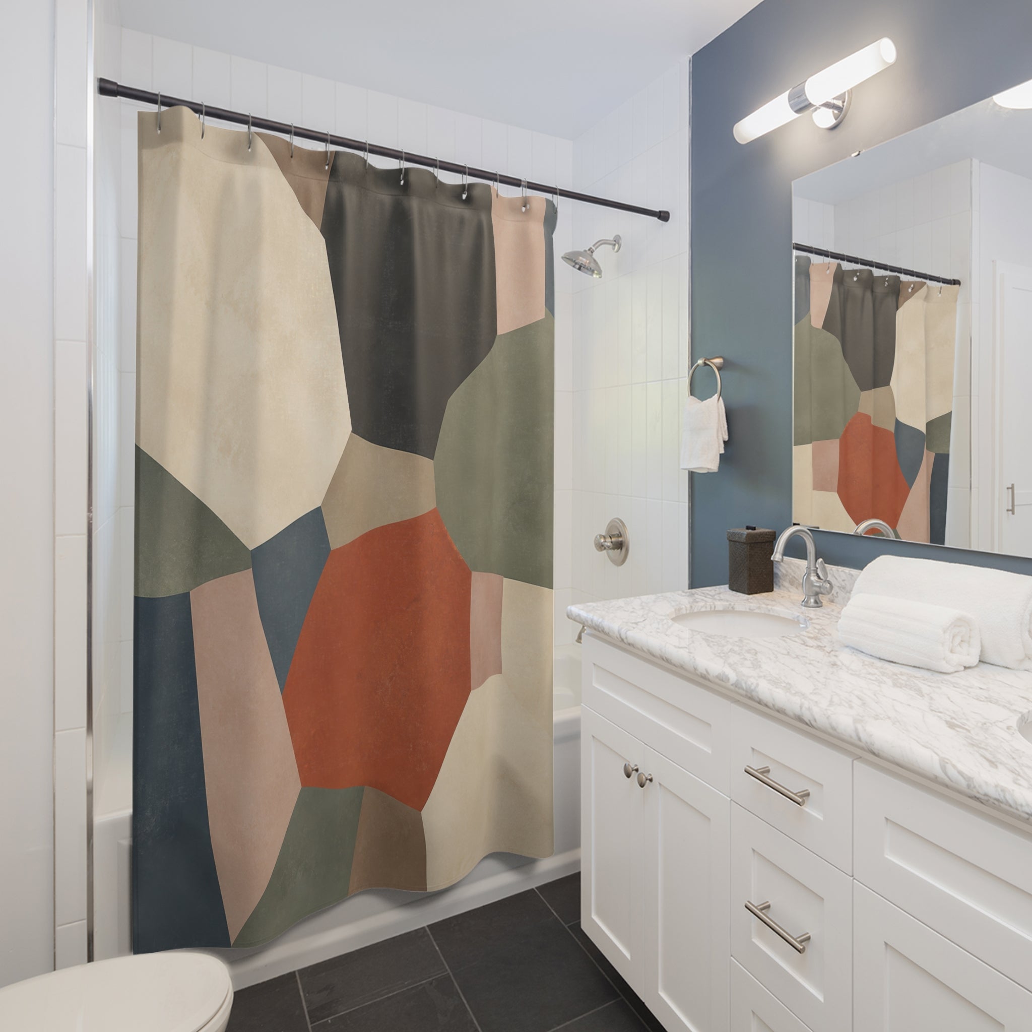 Terracotta mineral patchwork slabs shower curtain beside a white vanity