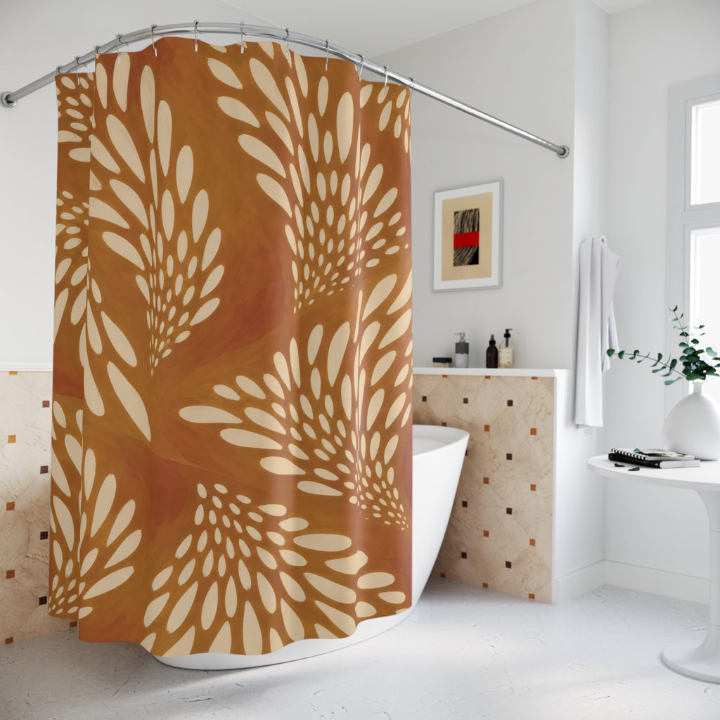Cream fawn spot fans on ochre and burnt orange shower curtain beside a freestanding tub