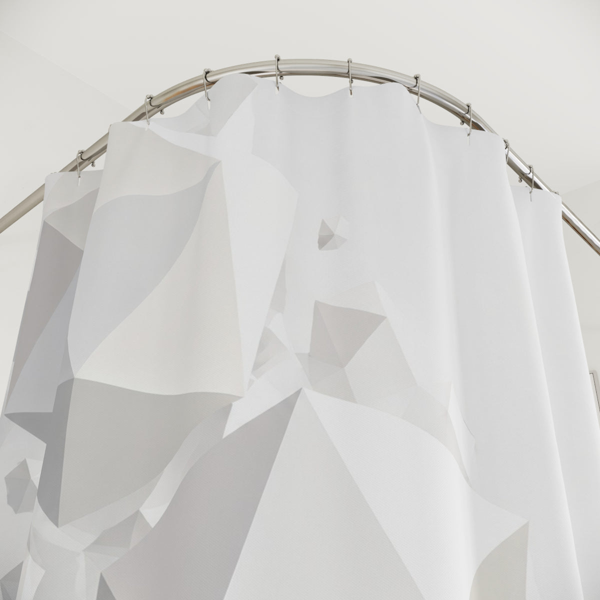 Floating white polyhedra cascading across a pale mist-gray field shower curtain with close-up print, hooks, and folds