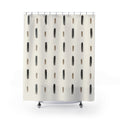 Charcoal and taupe ink dashes in spaced rows on ivory shower curtain with full front view