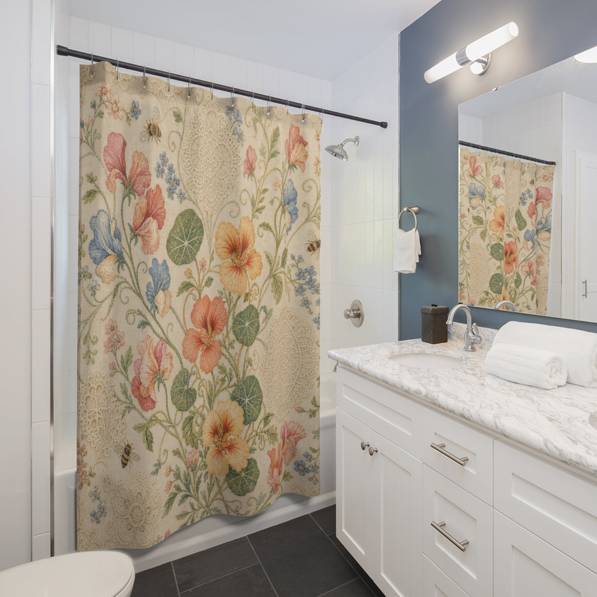 Vintage Nasturtium cream coral blue shower curtain beside a white vanity