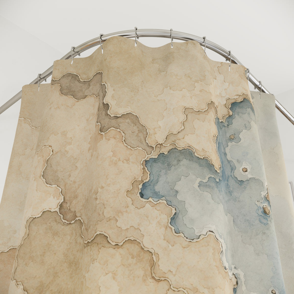 Beige coastline watercolor map shower curtain with close-up print, hooks, and folds