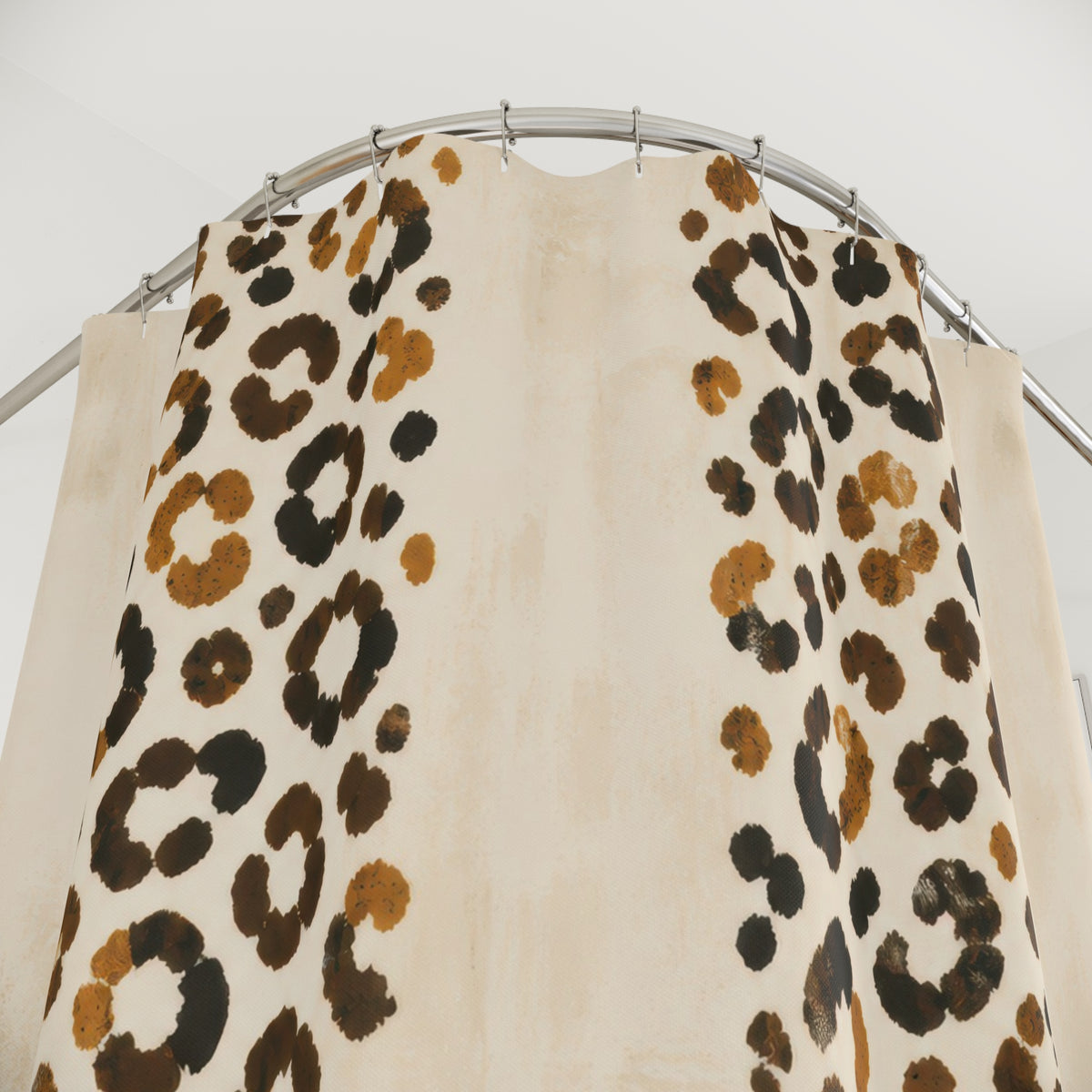 Twin bands of ochre cheetah print on cream shower curtain with close-up print, hooks, and folds