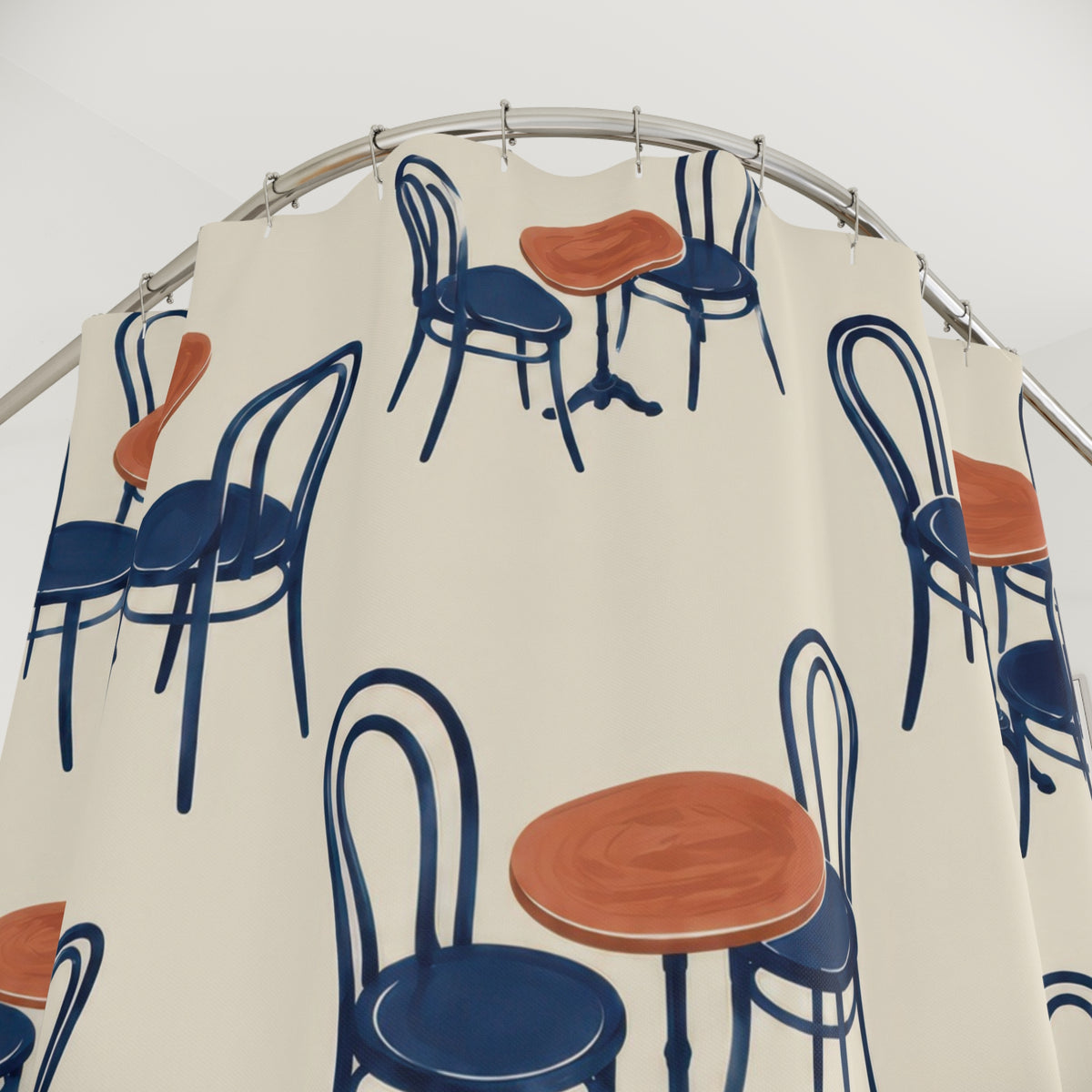 Navy bentwood chairs and terracotta café tables on ivory shower curtain with close-up print, hooks, and folds