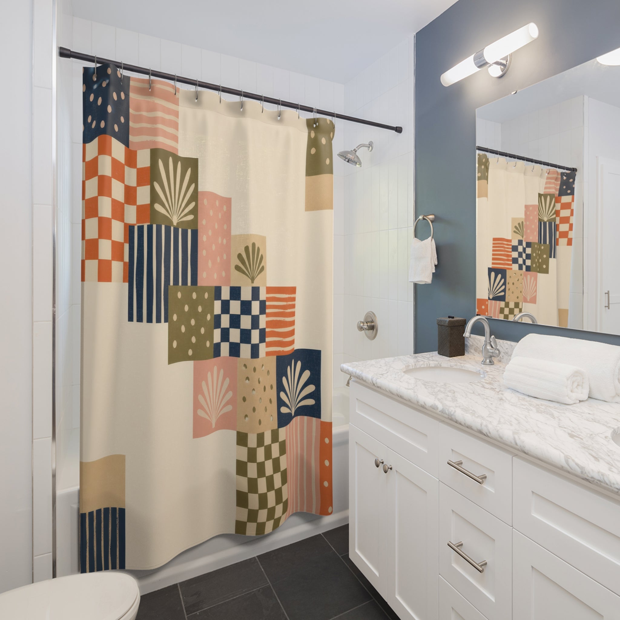Indigo stepped patchwork panels shower curtain beside a white vanity