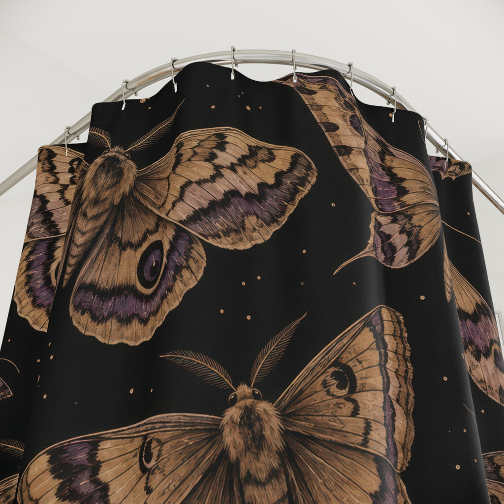 Tan moths with purple markings on black shower curtain with close-up print, hooks, and folds