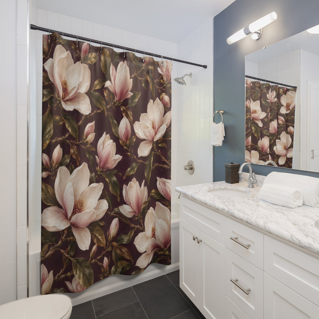 Cream magnolias and olive leaves on wine plum shower curtain beside a white vanity
