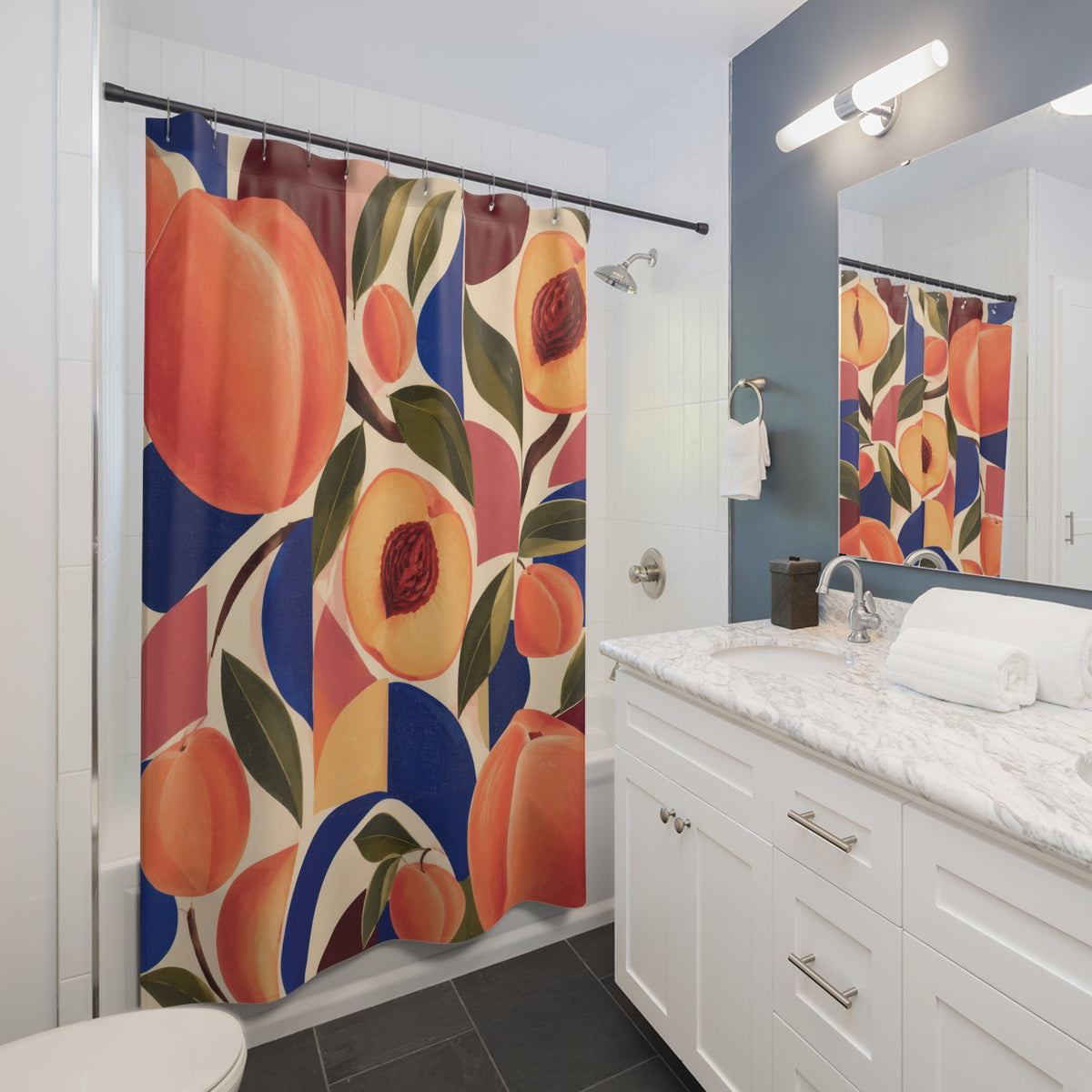 Peaches with cobalt and burgundy geometric arcs shower curtain beside a white vanity