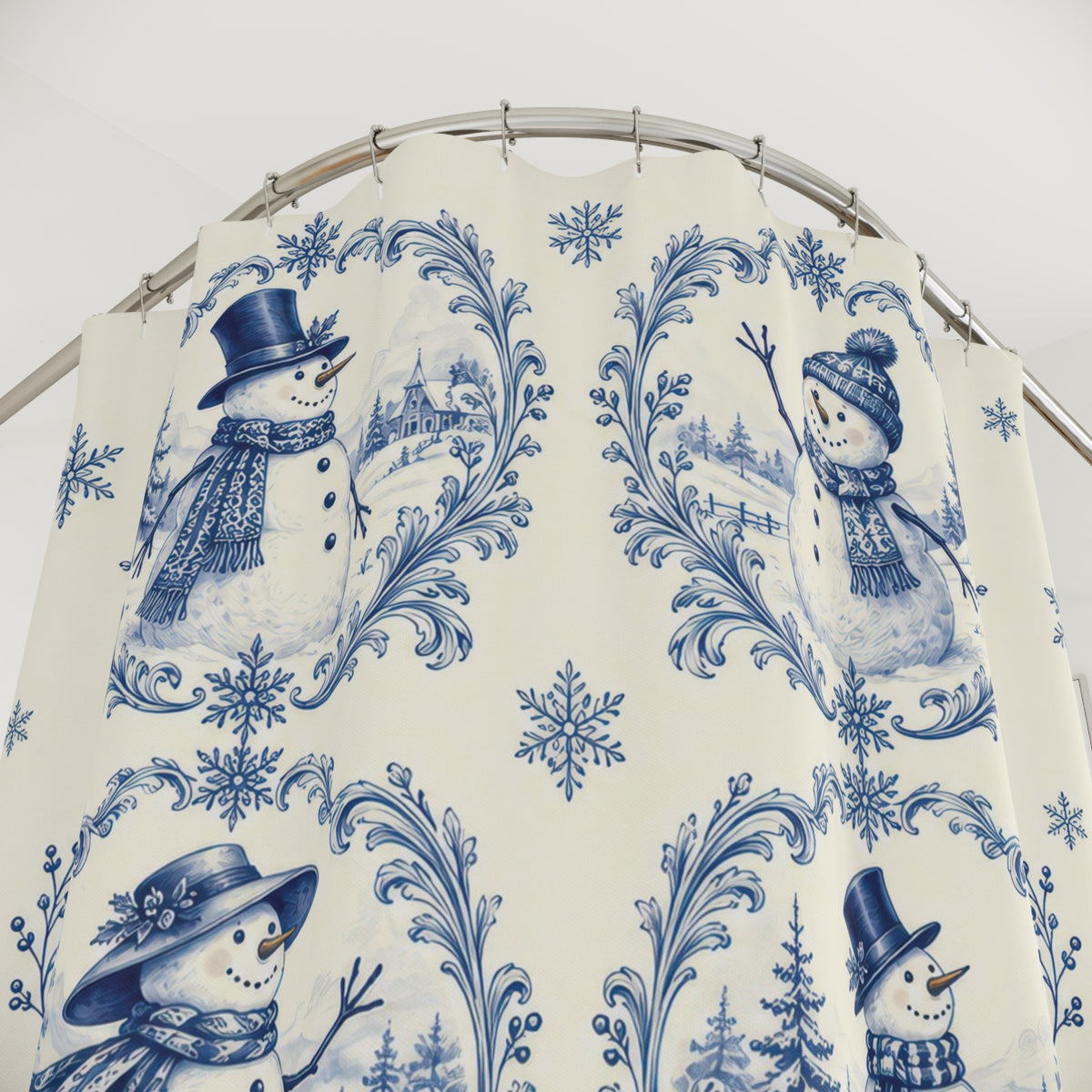 Blue snowman toile vignettes and snowflakes on ivory shower curtain with close-up print, hooks, and folds