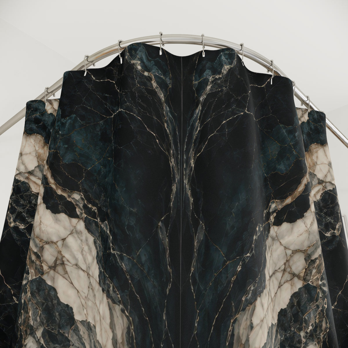Mirrored cream marble veins on black and deep teal shower curtain with close-up print, hooks, and folds