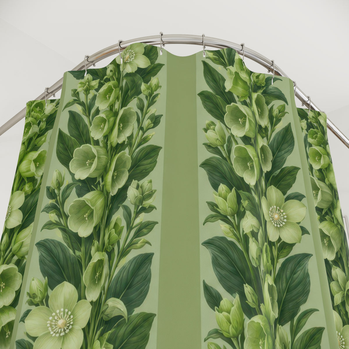 Pale green flowers and leafy stripes on celery green shower curtain with close-up print, hooks, and folds