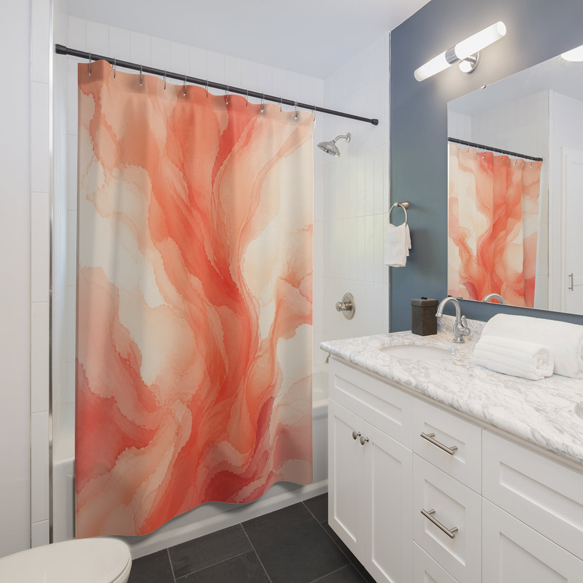 Flowing coral watercolor plumes on warm cream shower curtain beside a white vanity