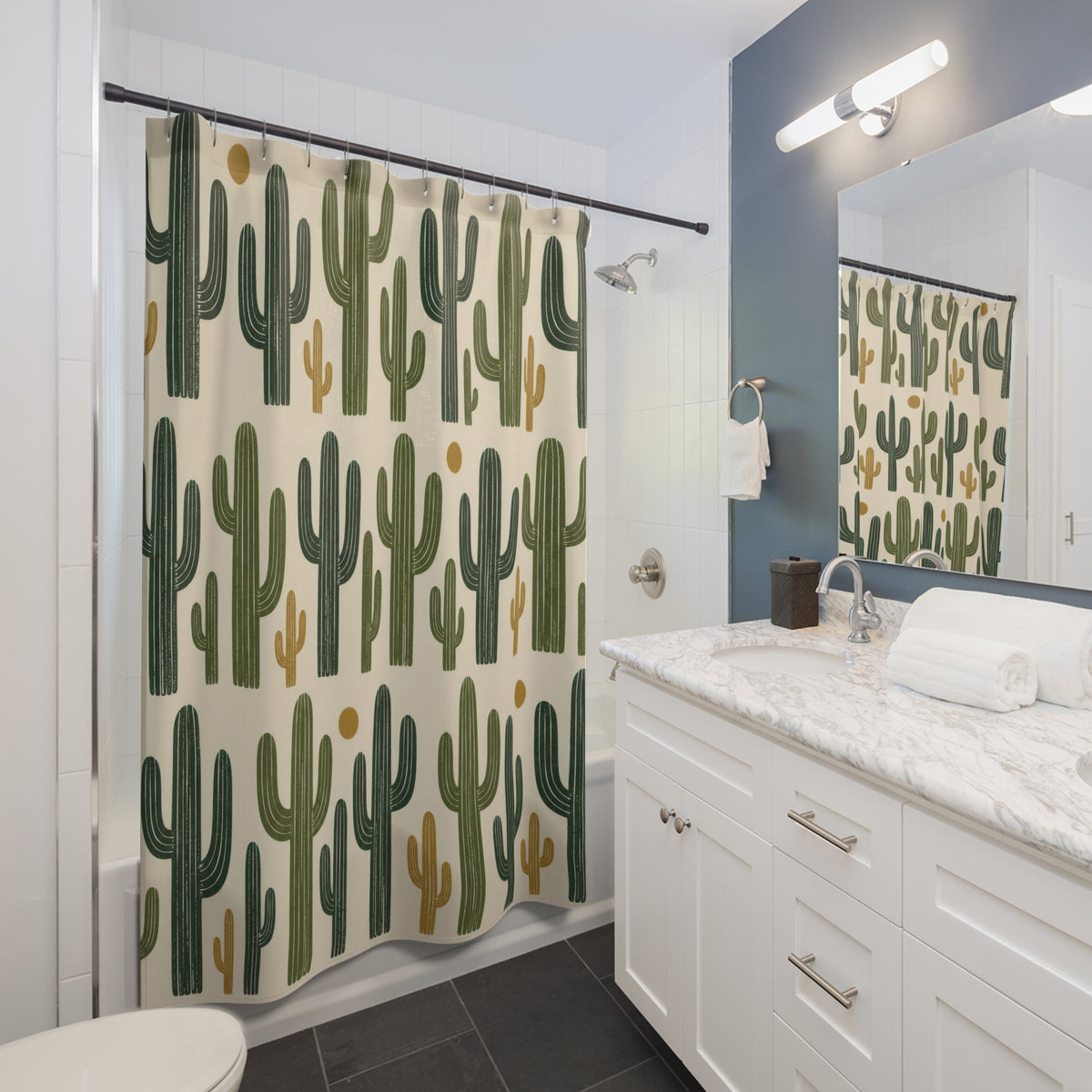 Green saguaro cactus pattern on cream shower curtain beside a white vanity
