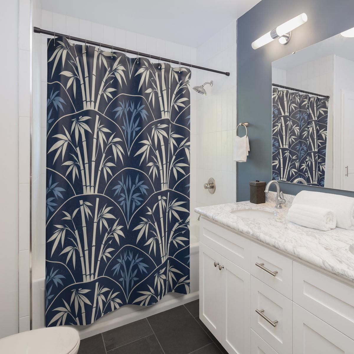 Ivory bamboo and blue leaves inside navy scallops shower curtain beside a white vanity