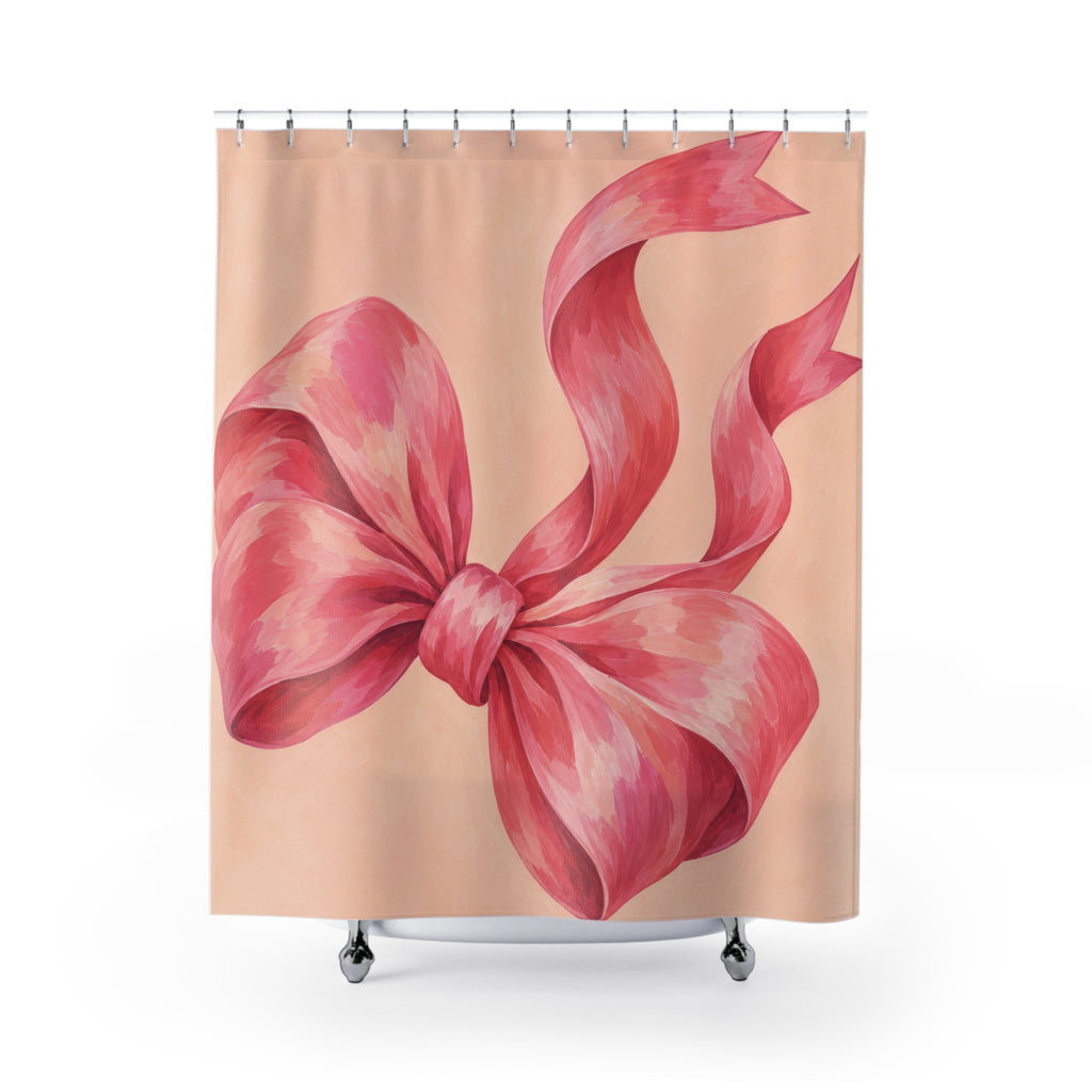 Oversized pink bow with curling tails on pale peach shower curtain with full front view