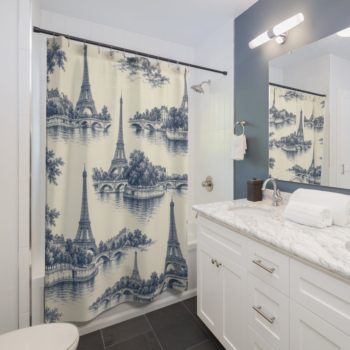 Indigo Eiffel Towers and river bridges on warm ivory shower curtain beside a white vanity