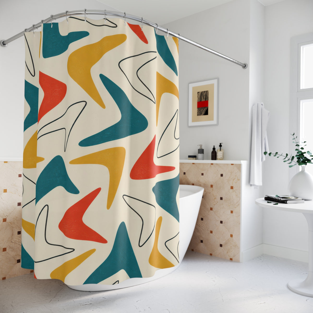 Teal, mustard and red boomerangs on ivory shower curtain beside a freestanding tub