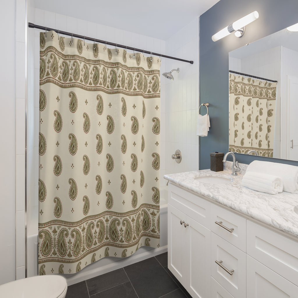 Sage paisley borders and rust outlines on cream shower curtain beside a white vanity