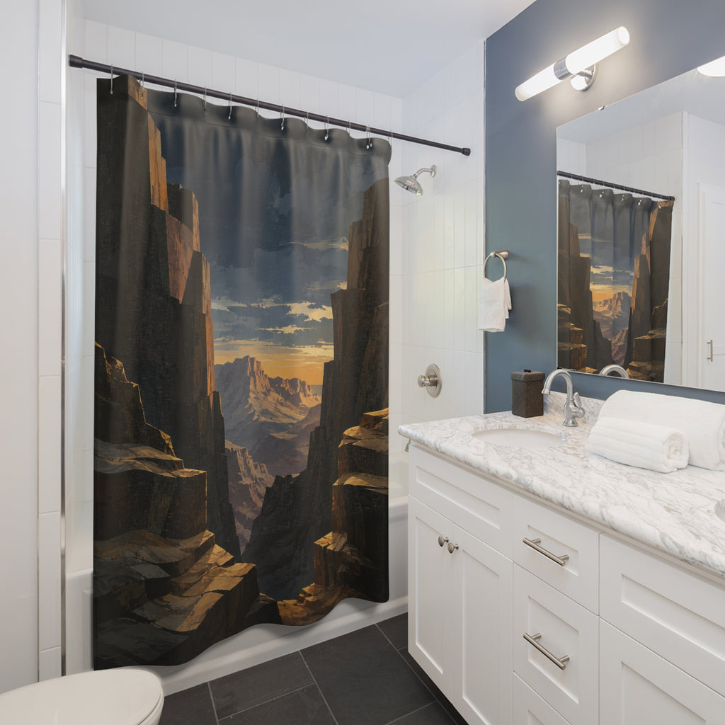 Charcoal desert canyon framing an amber sunset shower curtain beside a white vanity