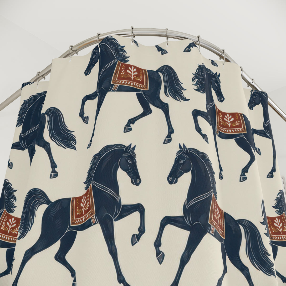 Navy prancing horses with rust saddles on warm ivory shower curtain with close-up print, hooks, and folds