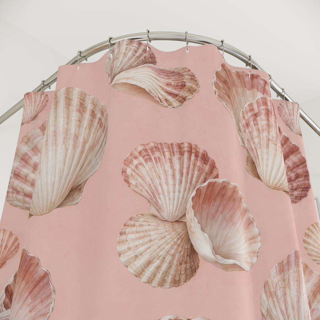 Ivory and rose seashells on blush pink shower curtain with close-up print, hooks, and folds