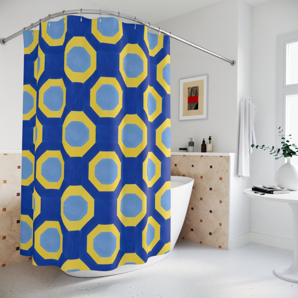Yellow octagonal bands and pale blue centers on cobalt shower curtain beside a freestanding tub