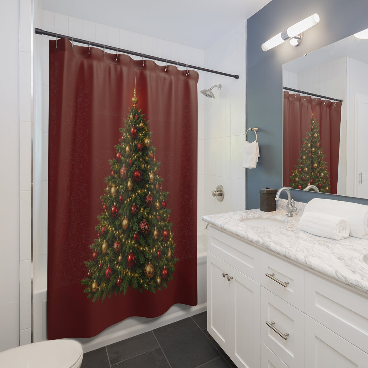 Green Christmas tree with gold baubles on garnet red shower curtain beside a white vanity