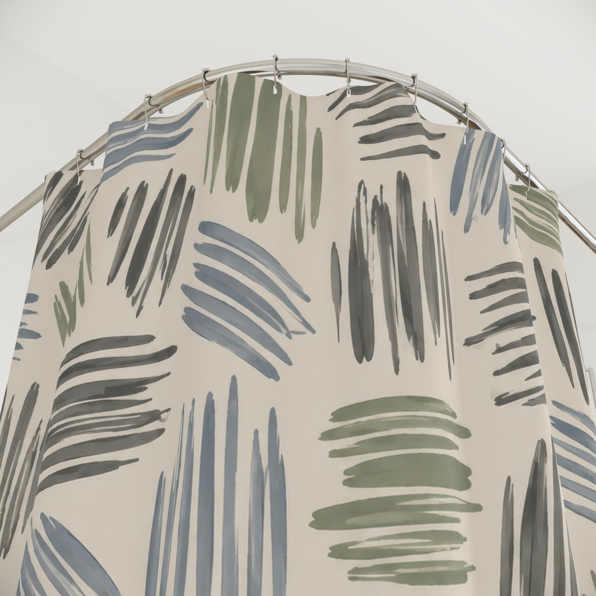 Sage, dusty blue and gray hatch marks on cream shower curtain with close-up print, hooks, and folds