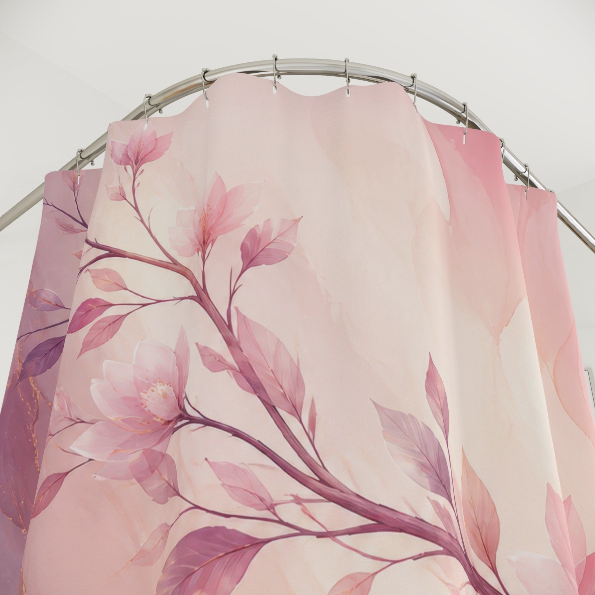 Blush and lilac watercolor branch sweeping across an airy field shower curtain with close-up print, hooks, and folds