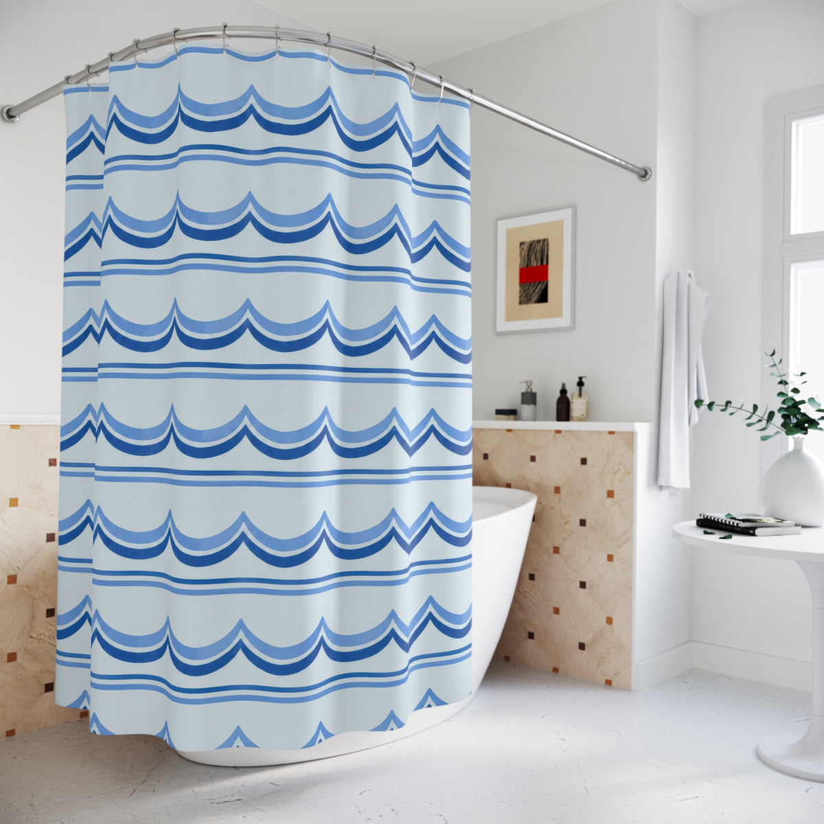 Cornflower and cobalt scallop bands on pale blue shower curtain beside a freestanding tub