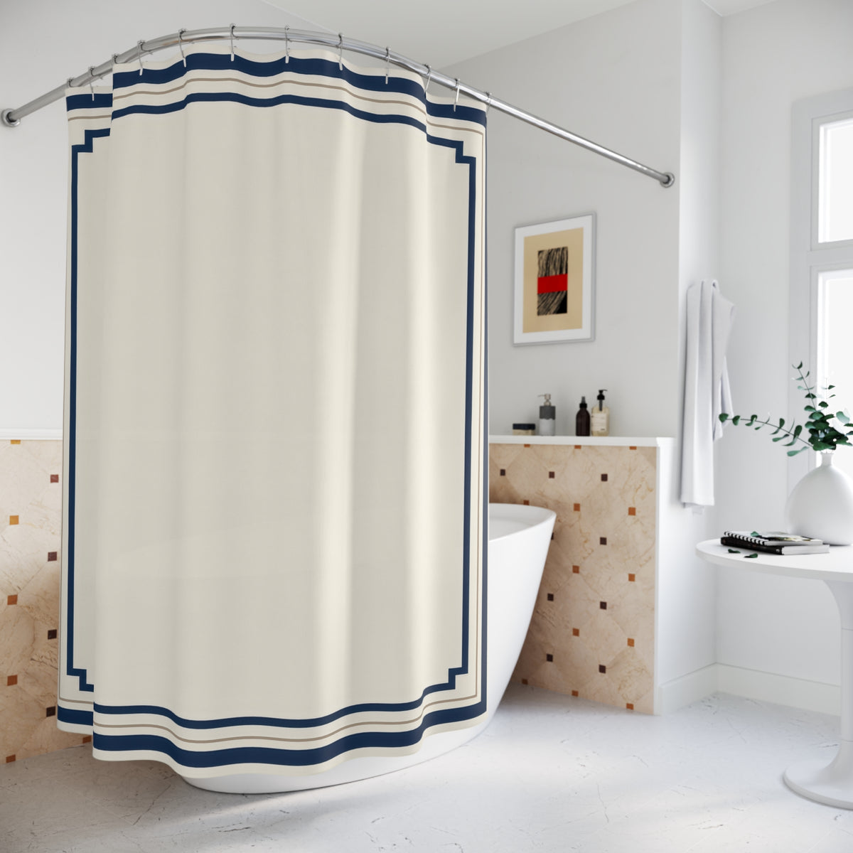 Navy stepped borders around an ivory center shower curtain beside a freestanding tub