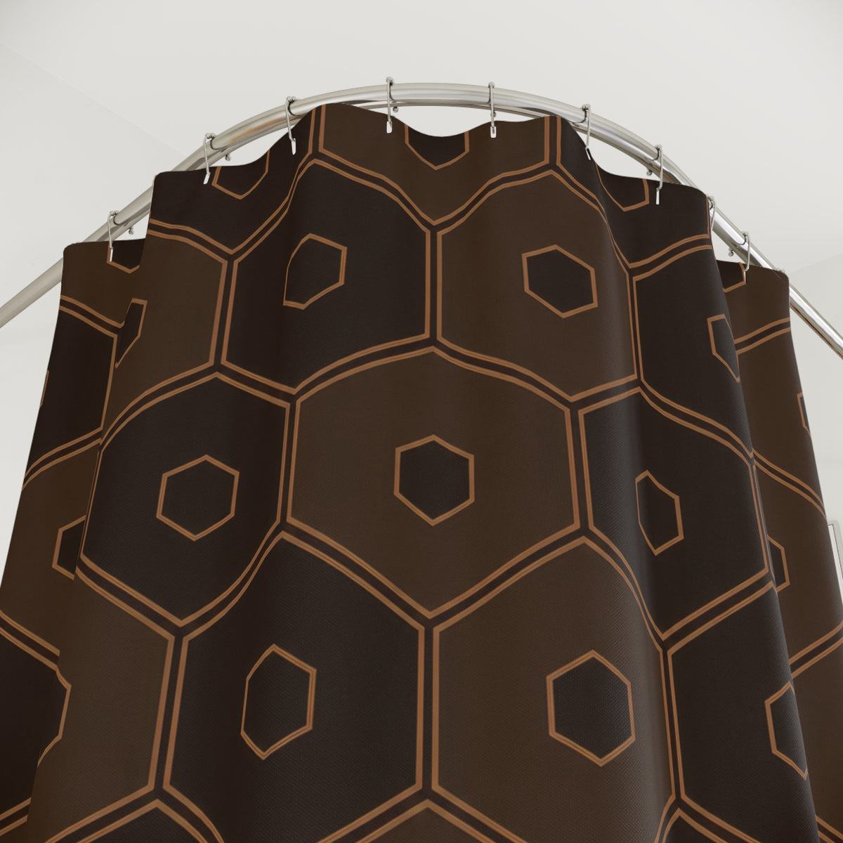 Dark brown nested hexagons with caramel outlines shower curtain with close-up print, hooks, and folds