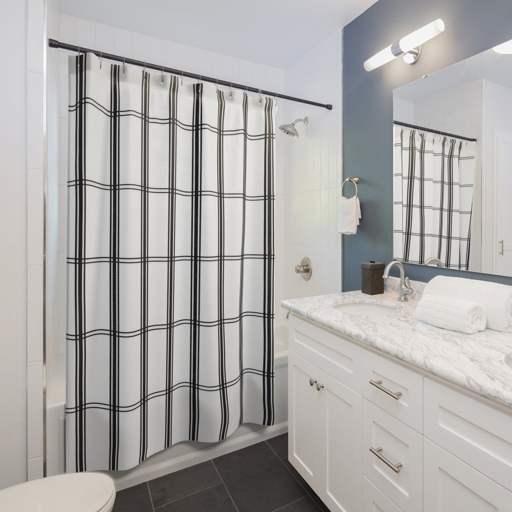 Black vertical stripe groups and fine windowpane crossbars shower curtain beside a white vanity