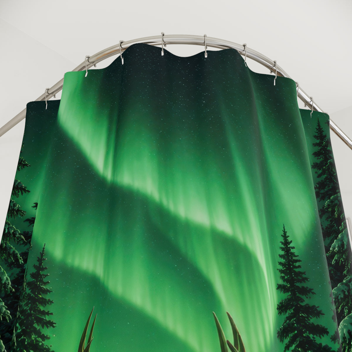 Buck under green aurora in snowy pines shower curtain with close-up print, hooks, and folds