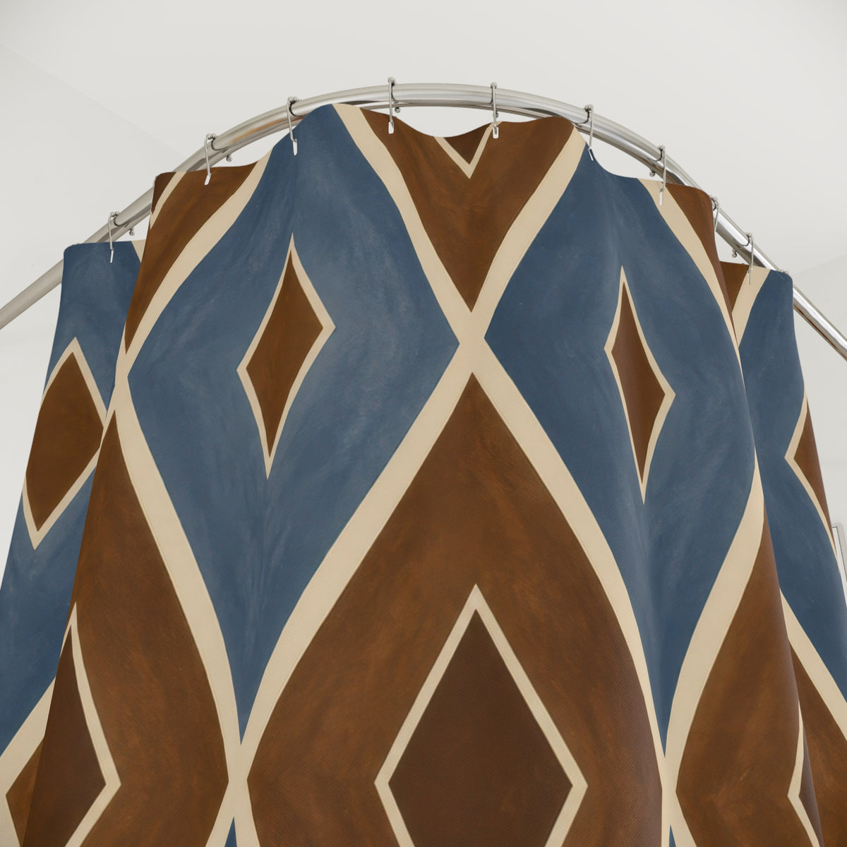 Blue and brown diamond lattice with ivory lines shower curtain with close-up print, hooks, and folds