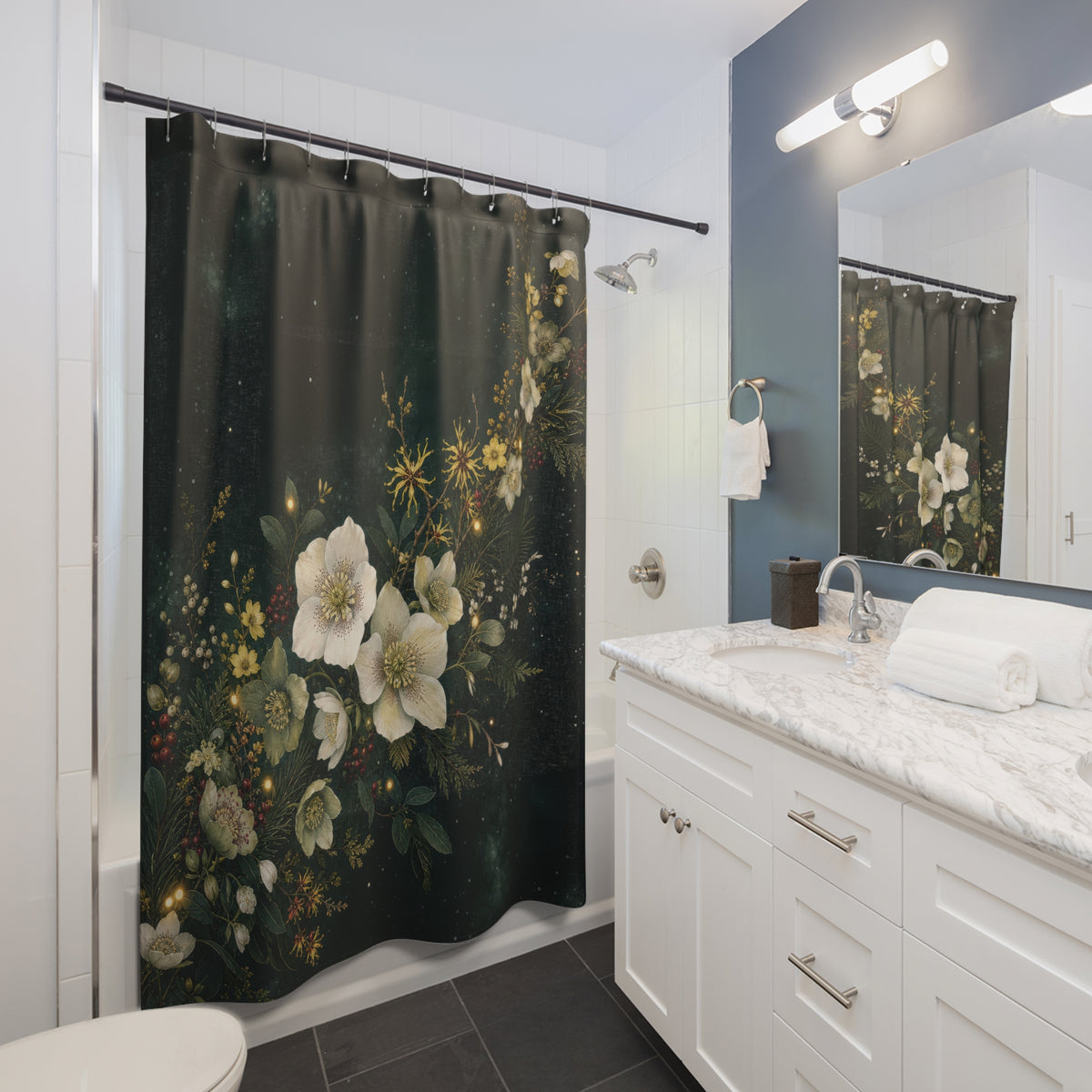 Winter hellebores and evergreen garland on forest green shower curtain beside a white vanity