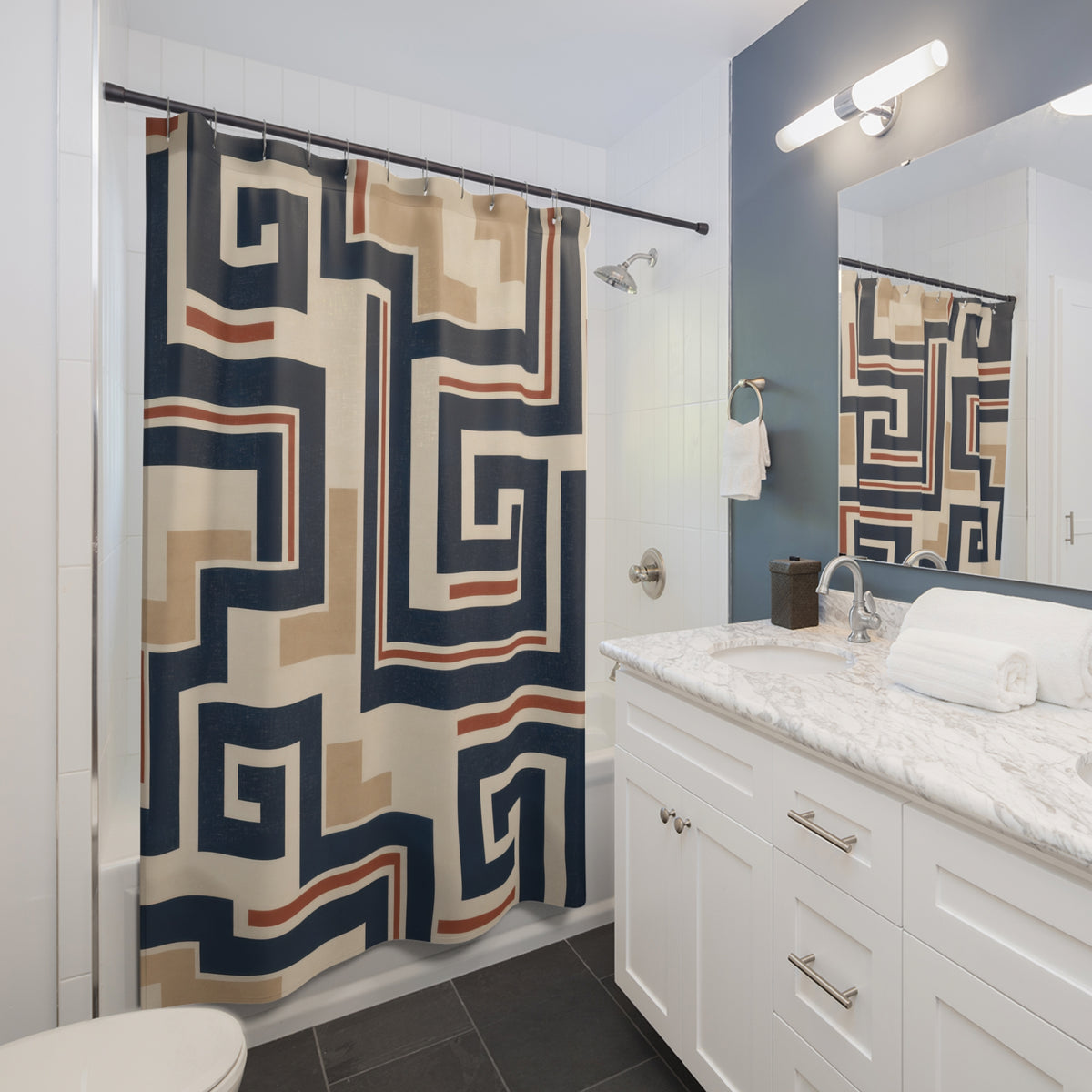 Navy rust and cream Southwestern fretwork geometric pattern shower curtain beside a white vanity