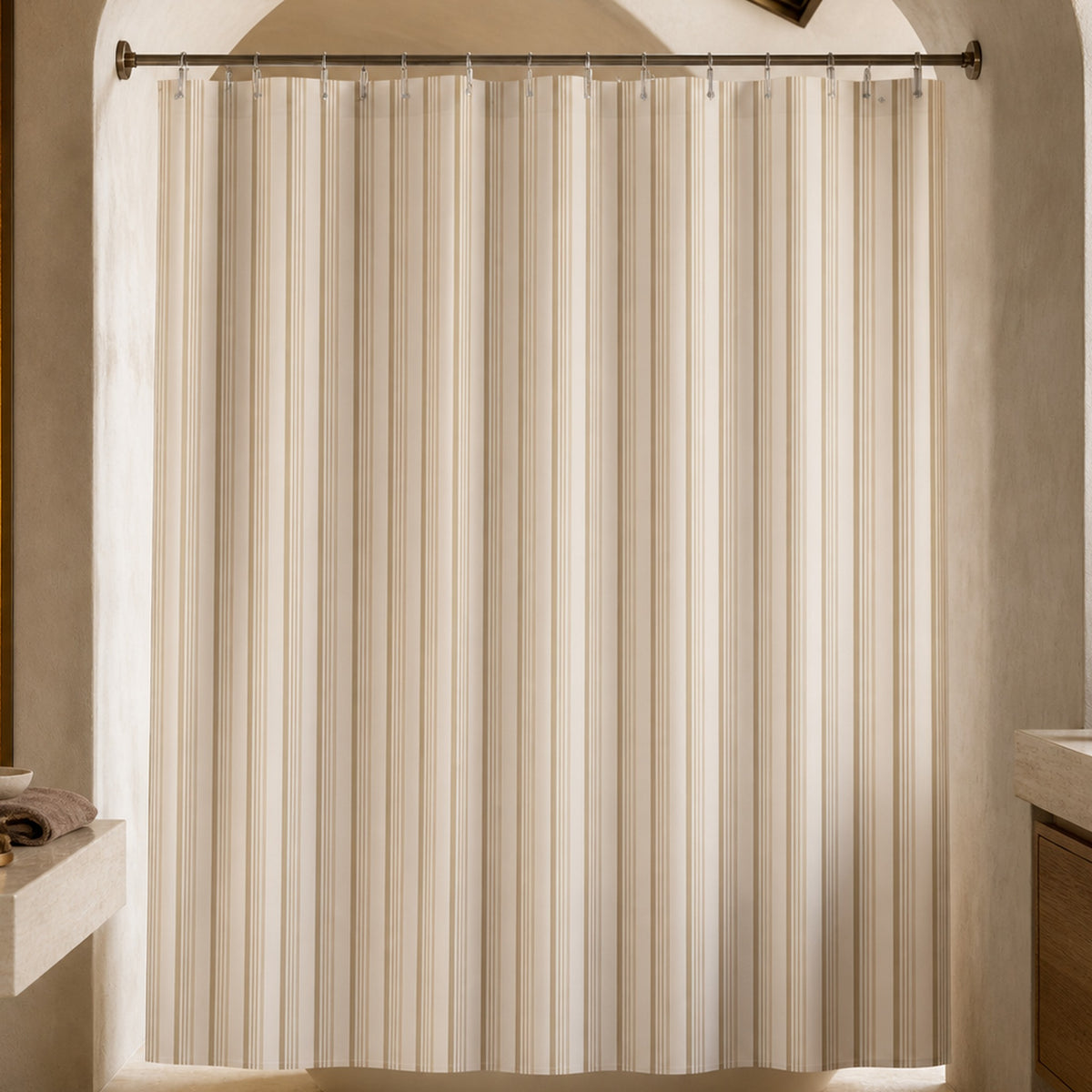 Cream tone-on-tone striped shower curtain in a sculpted plaster designer bathroom with amber glass