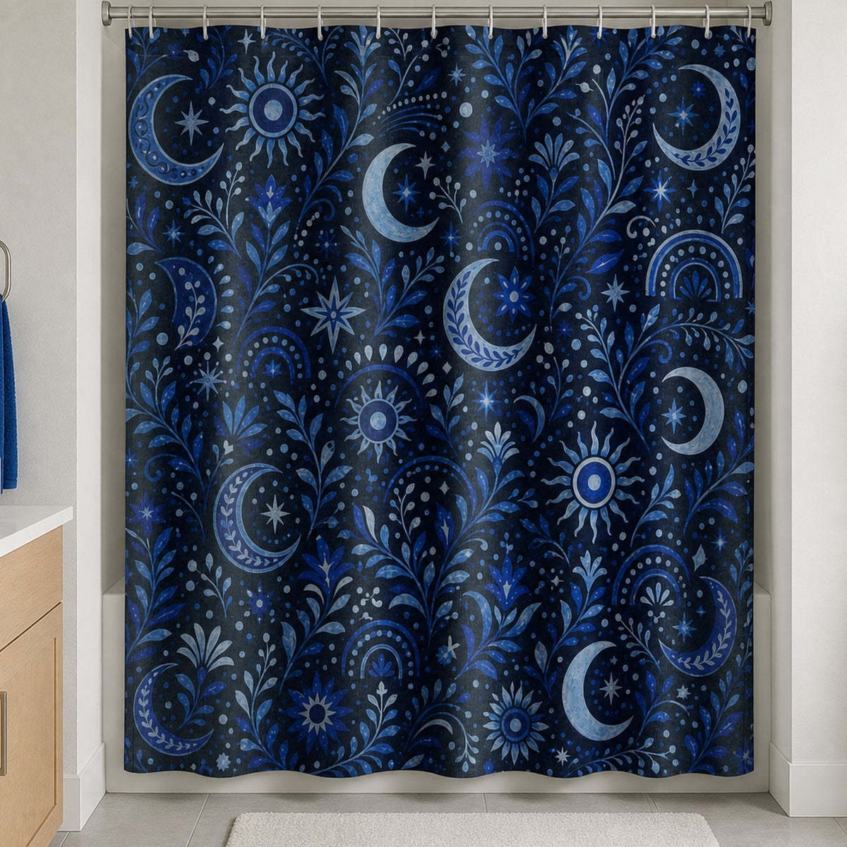 Navy celestial moon and sun shower curtain in a bright guest bathroom with maple vanity and cobalt towel