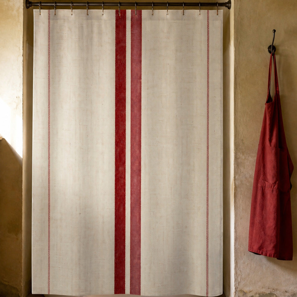 French red stripe shower curtain in a sunwashed Provence furniture restorer washroom with plaster and oak
